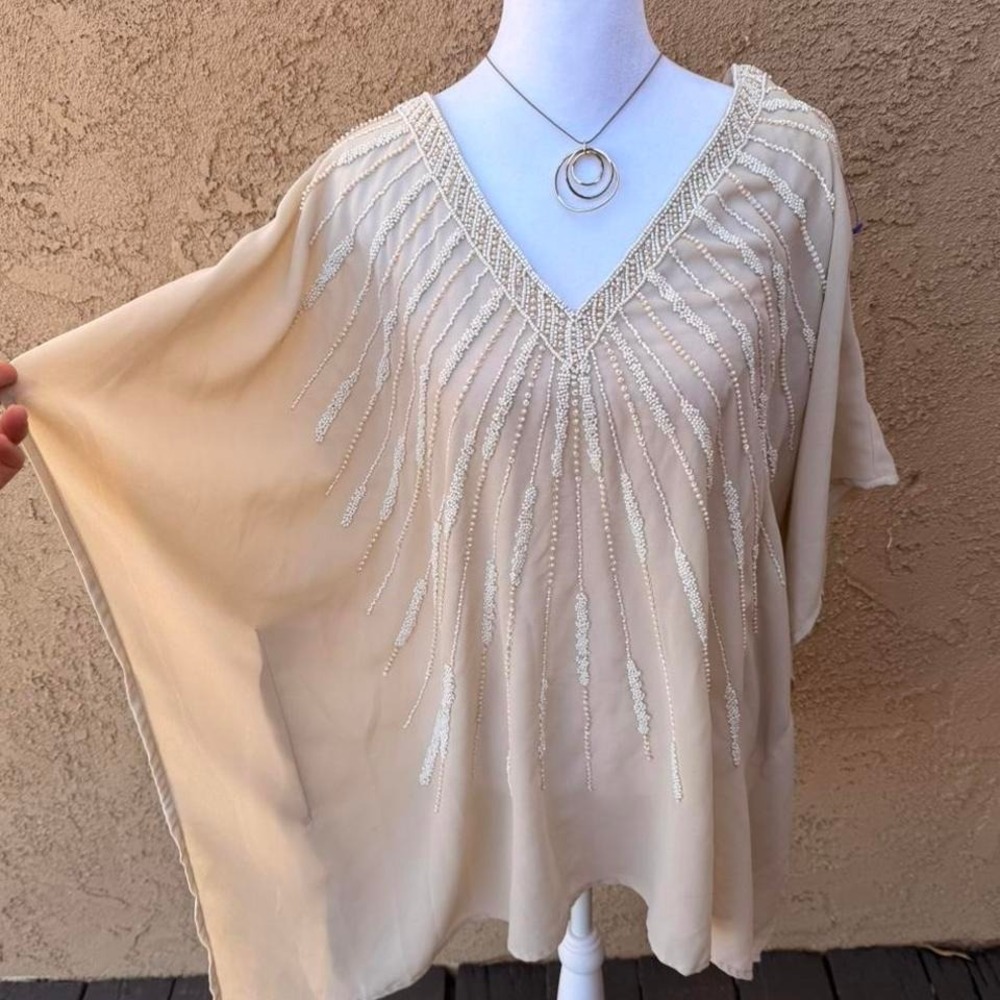 Cream beaded mesh poncho top and V-neckline